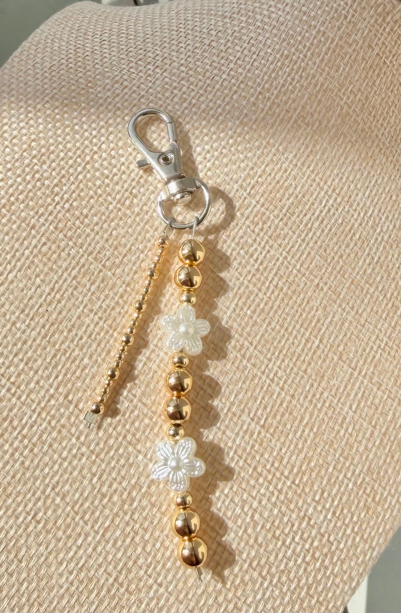 Gold and white floral keychain