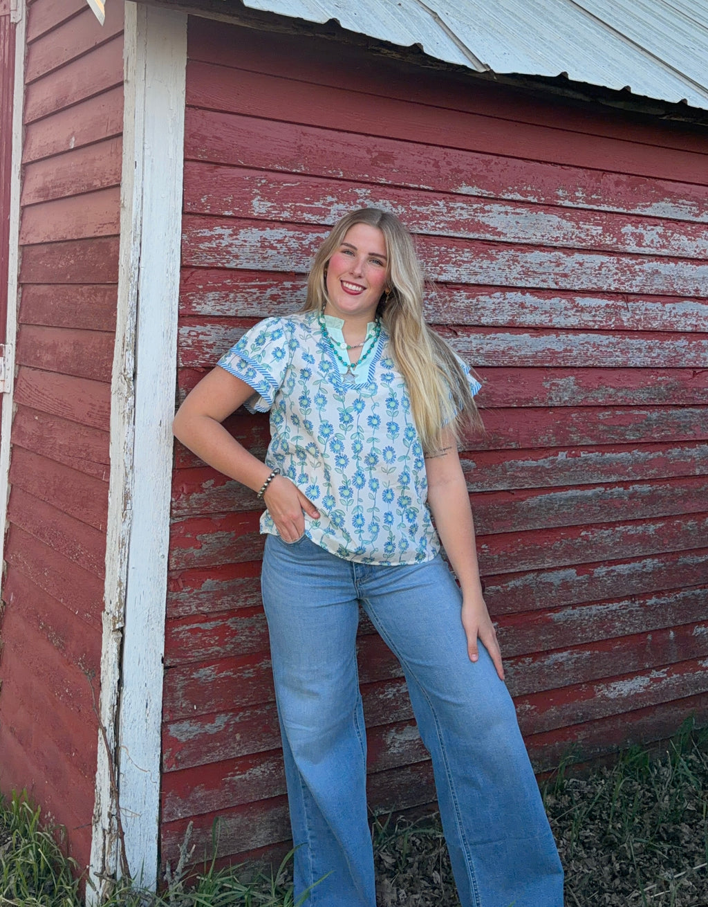 Blue and green floral blouse
