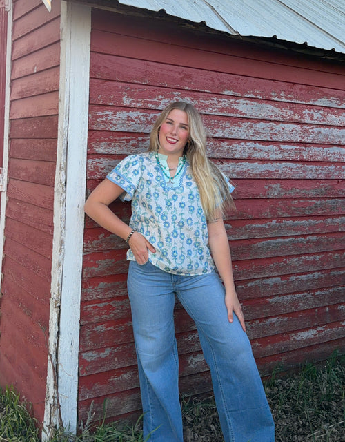 Blue and green floral blouse